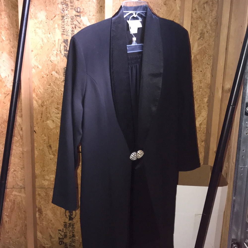 Beautiful black suit closes wit pendant